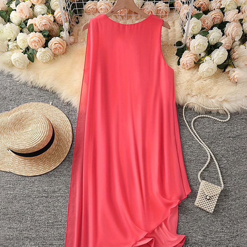 Elegante vestido sin mangas con escote redondo y malla asimétrica.-ES